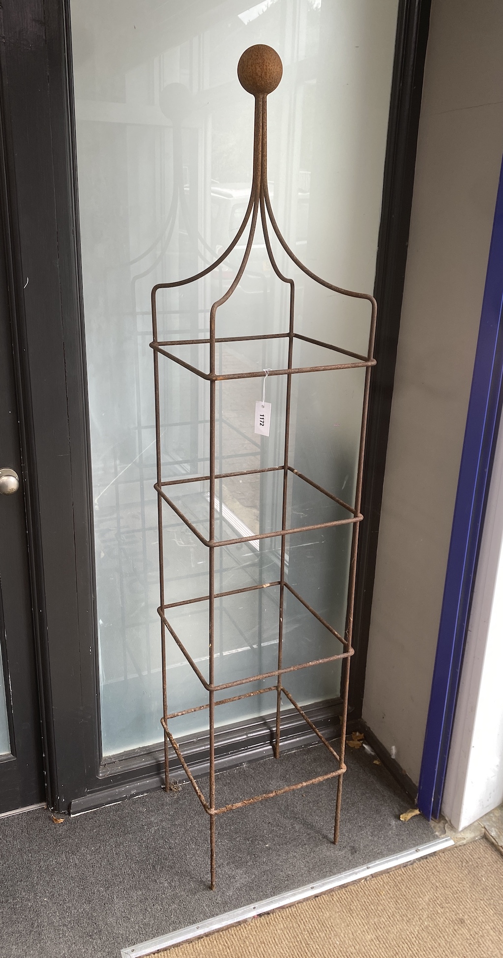 Two wrought iron garden obelisk growing frames, height 194cm